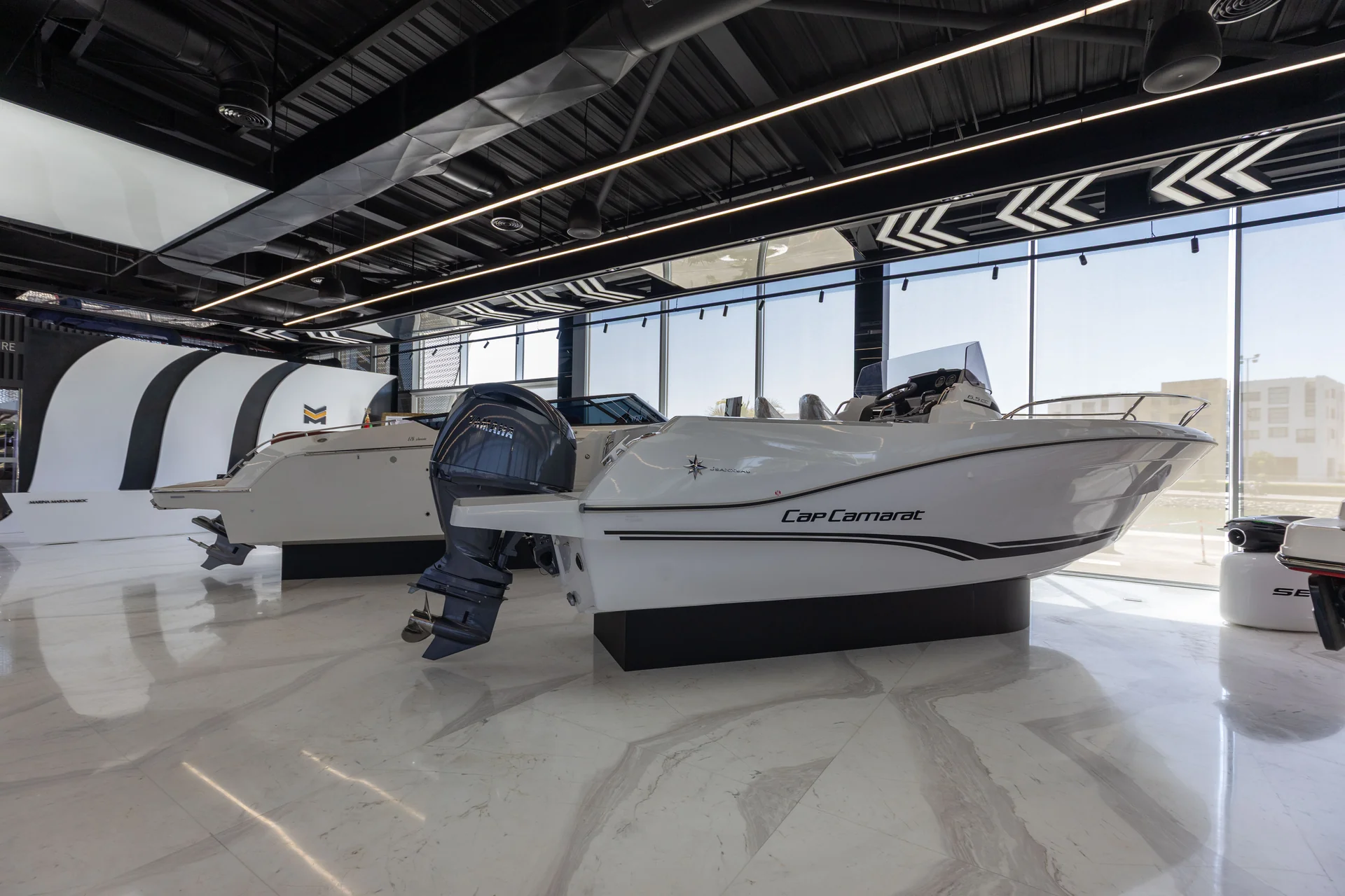 A Jeanneau Cap Camarat displayed inside the Marina Marsa Maroc showroom
