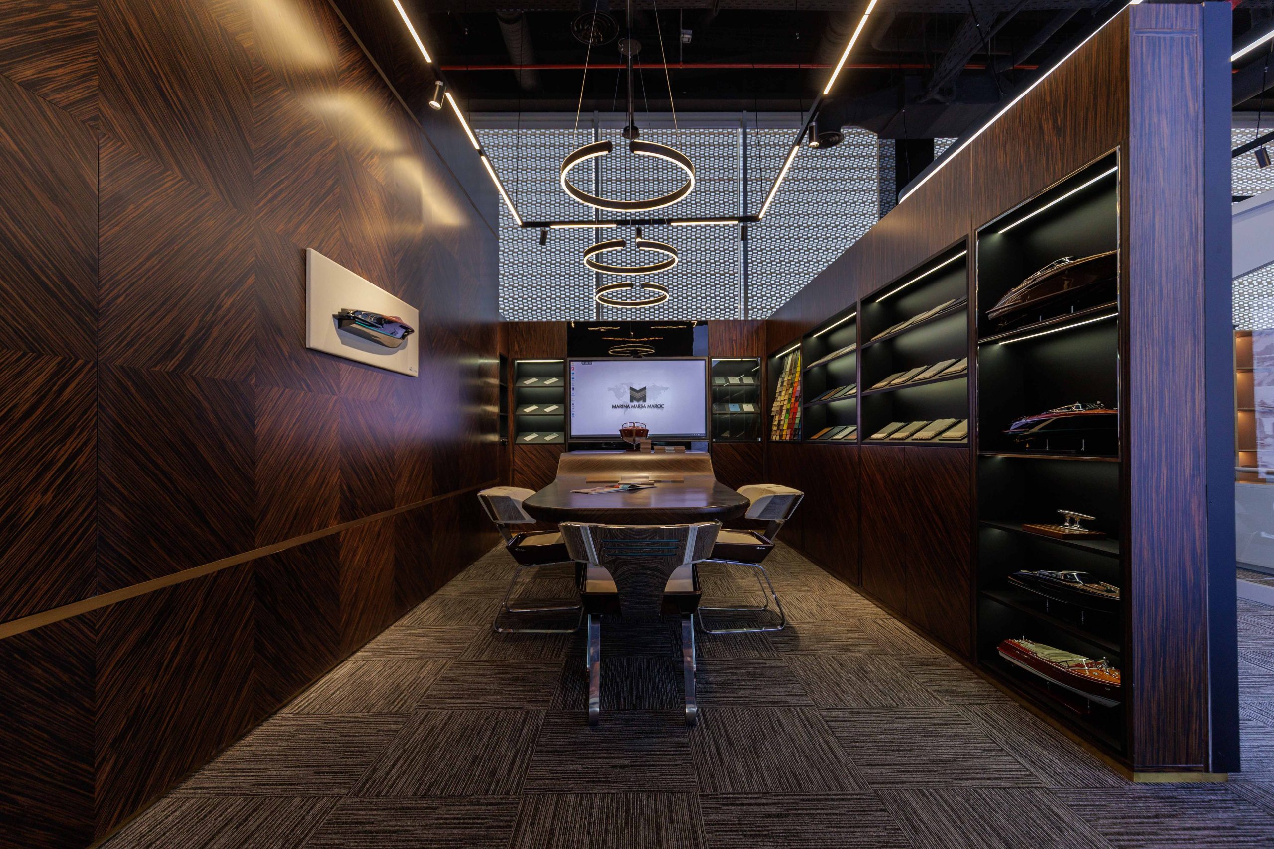 Private client lounge with a model yacht display wall