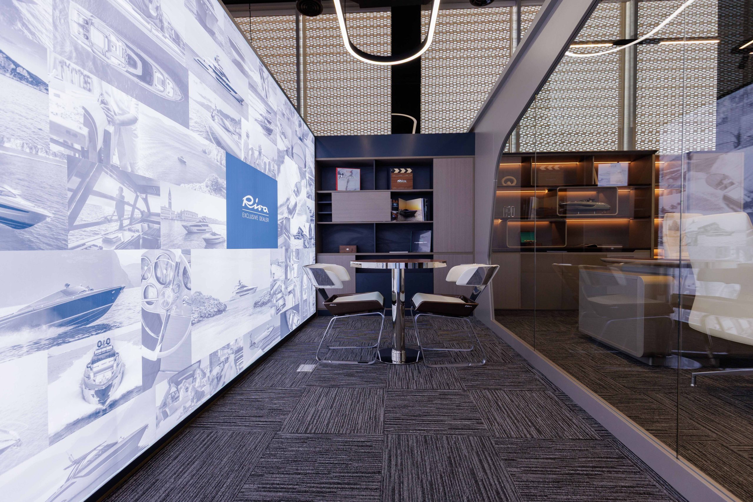 Riva exclusive dealer lounge with a photo mural wall and private meeting table