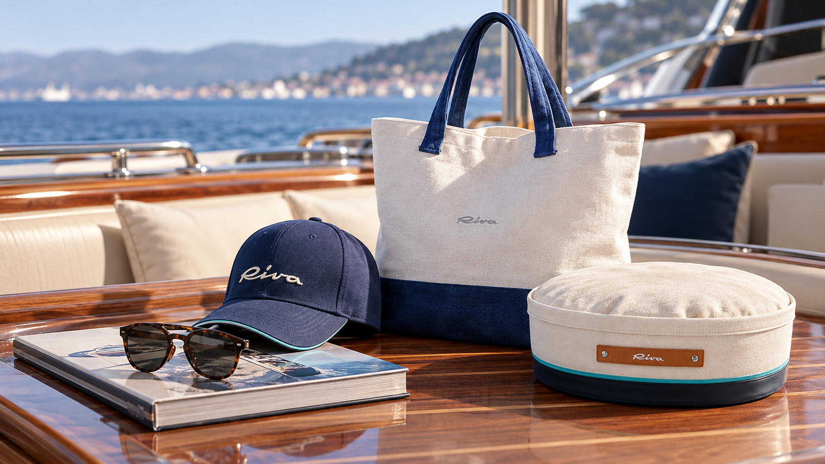 Riva accessories on a polished yacht table, with a canvas bag, navy cap, sunglasses and cushion