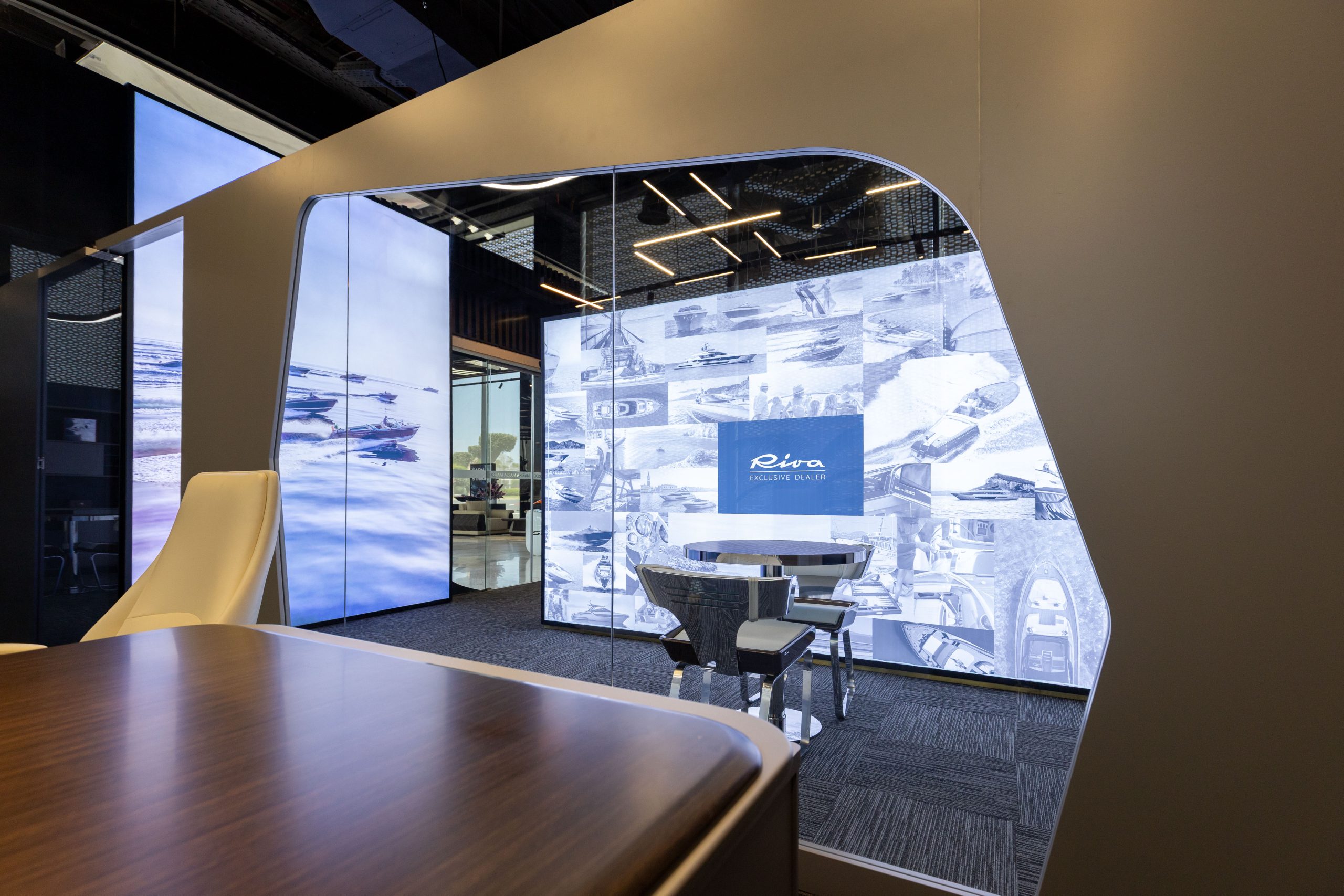 The consultation desk looking towards the illuminated Riva display and lounge