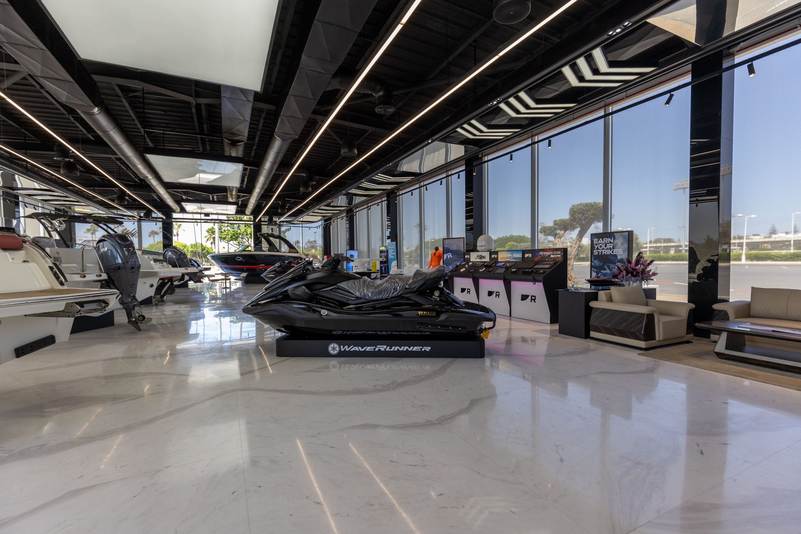 Yamaha WaveRunner and marine equipment displays inside the Marina Marsa Maroc showroom