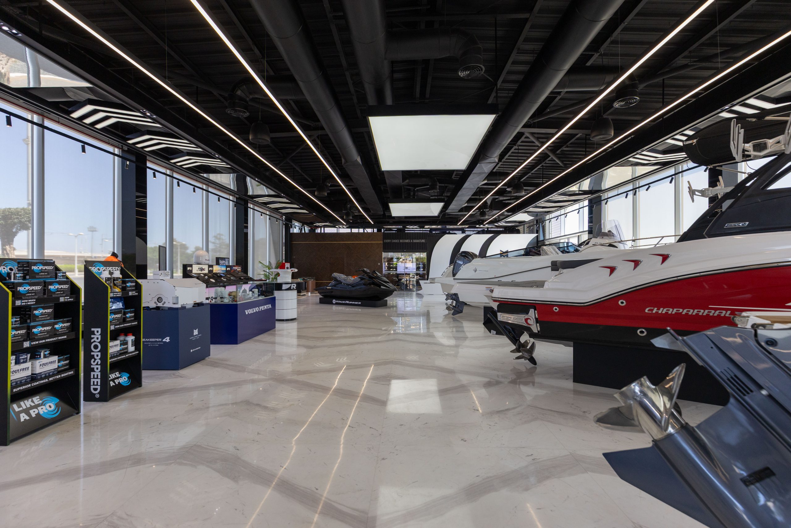 A wide view of the Marina Marsa Maroc showroom, with boats and marine equipment