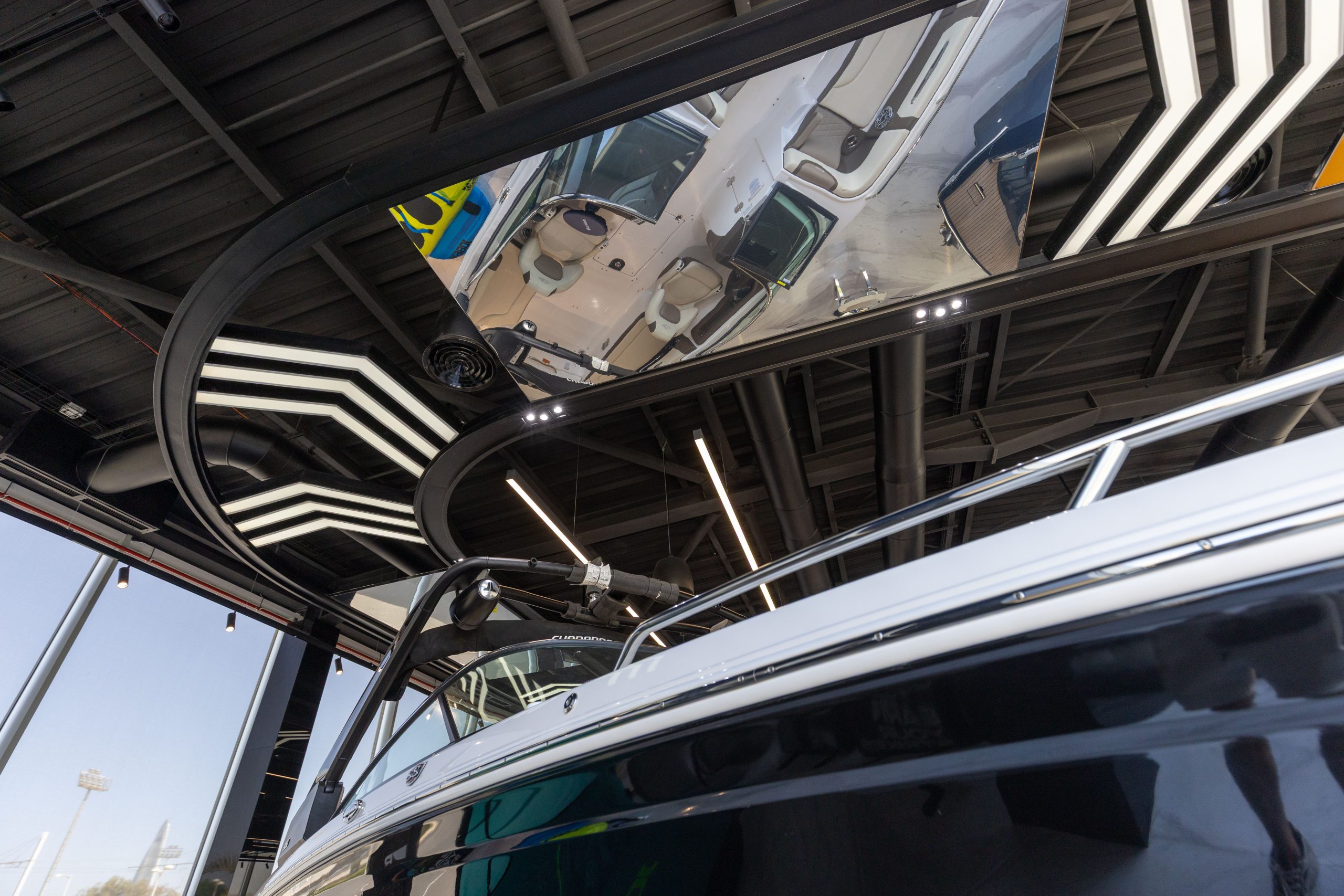 Boat detailing and architectural reflections inside the showroom